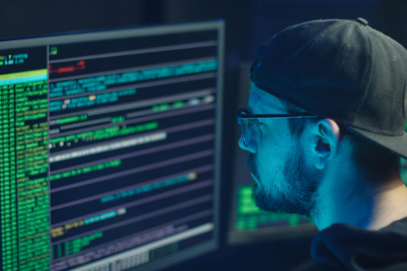 Banner Image of a person with a screenshot of code